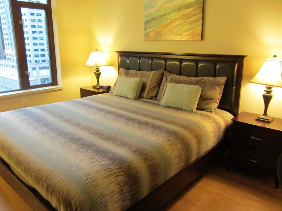 Master with king bed and city views
