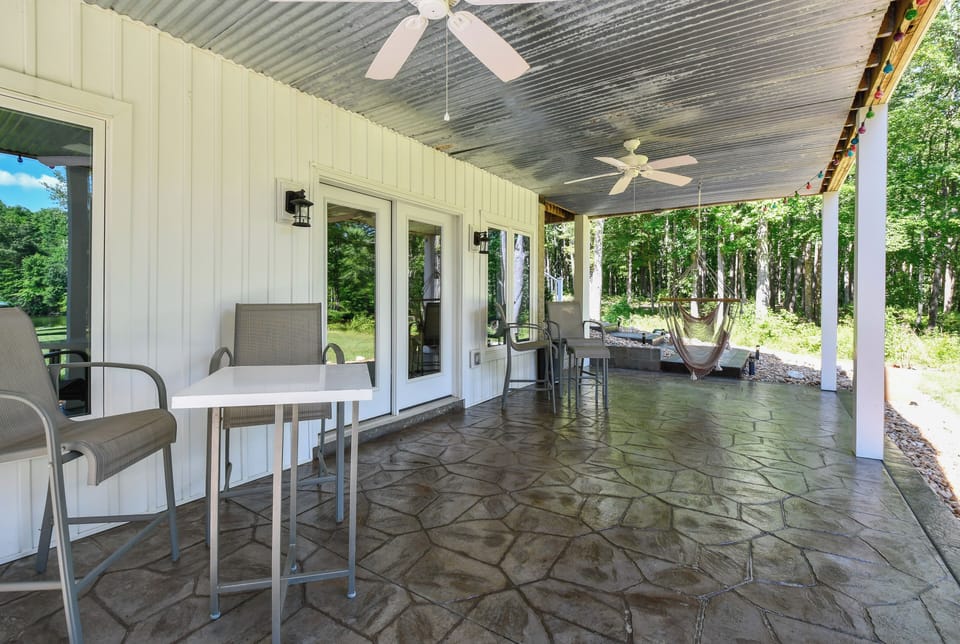 Covered Patio off the walk out basement facing lake- Gas grill is on this level