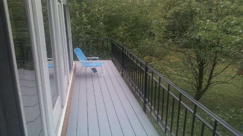 Beautiful composite deck wraps around 3 sides of the pool & overlooks 1.4 acre