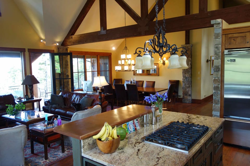 Under counter wine fridge. View to living room and main dining table