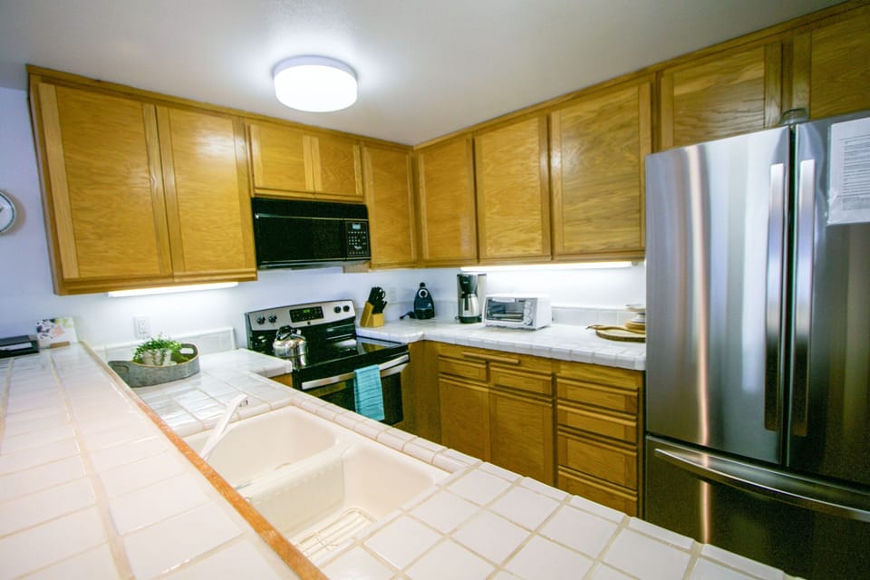Condo, 2 Bedrooms | Private kitchen | Fridge, microwave, dishwasher, coffee/tea maker