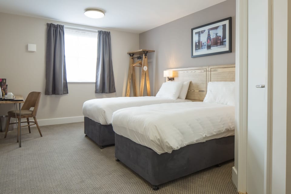 Twin Room | Desk, iron/ironing board, travel crib, free WiFi