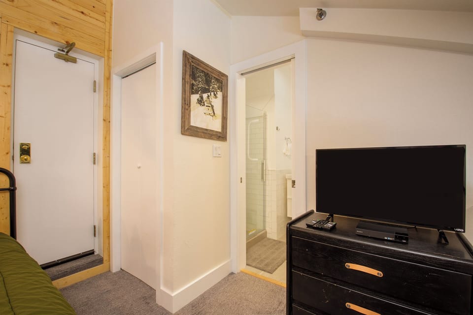Your cozy space features thoughtful touches like artwork and modern entertainment, creating a welcoming retreat after exploring.