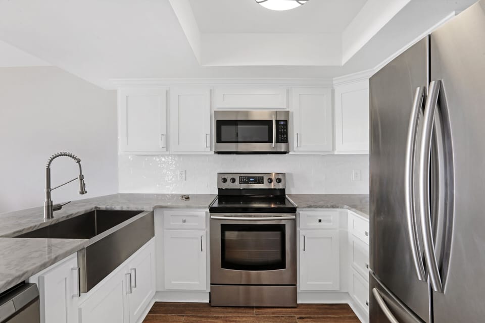 Modern Kitchen huge refrigerator and large farmhouse sink