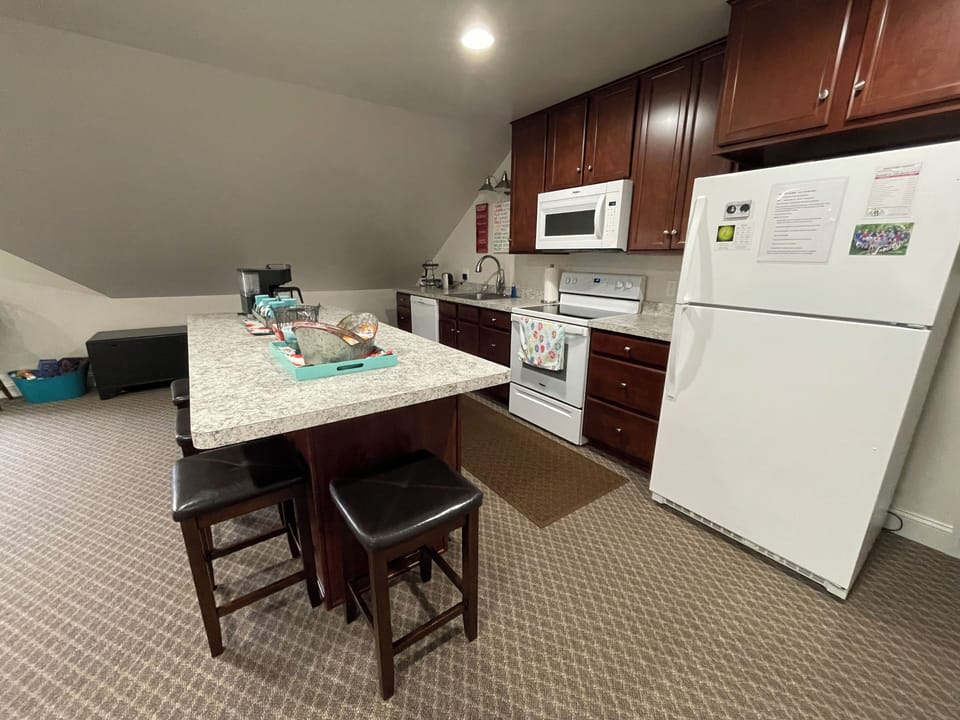 Full kitchen with stove, dishwasher, and fridge
