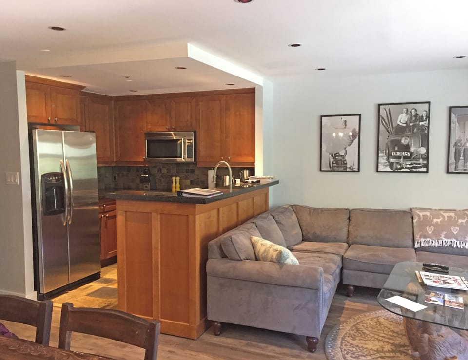 Open concept kitchen for convenient access to food as you lounge/watch TV