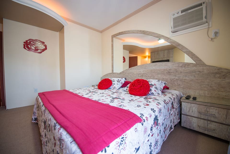 Deluxe Suite, Jetted Tub | Minibar, desk, blackout drapes, iron/ironing board