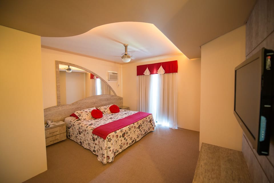 Deluxe Suite, Jetted Tub | Minibar, desk, blackout drapes, iron/ironing board