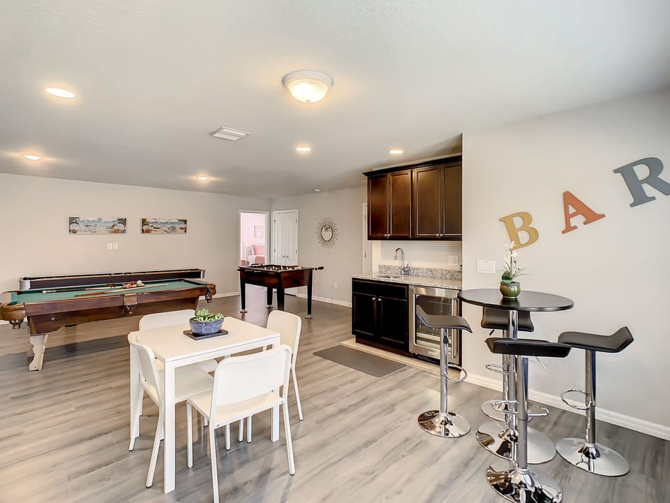 Game room with wet bar and seating for 8