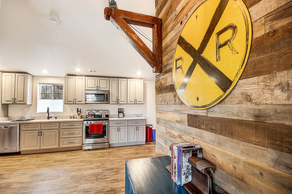 Open-concept filled with train memorabilia, decor, and antiques 