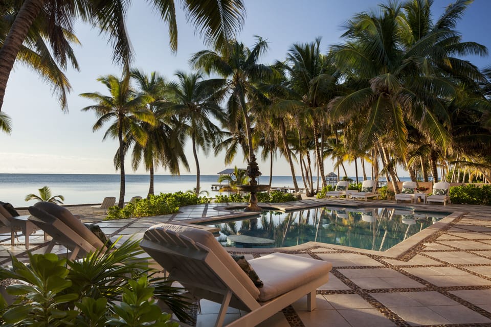 The pool has a table inside for refreshments. 