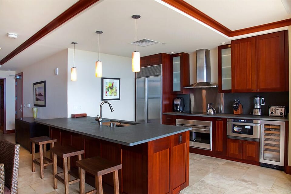 Gourmet kitchen features Sub-Zero, Wolf, Fisher & Paykel, and Kohler.