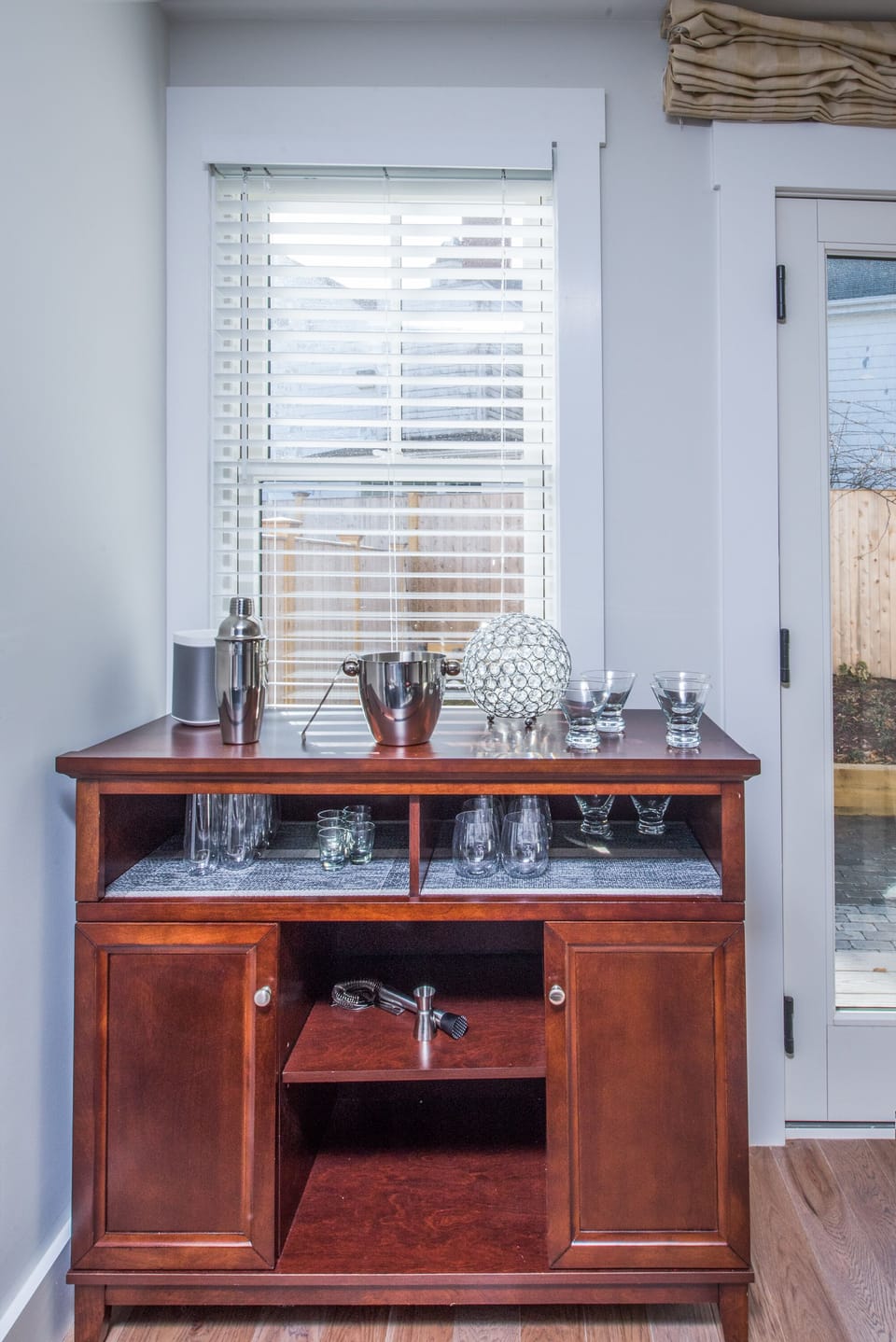 Complete bar set up for entertaining.  Martini, wine, champagne and shot glasses