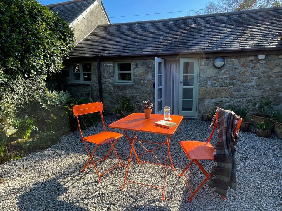 Sunny patio garden at the rear of The Little Barn