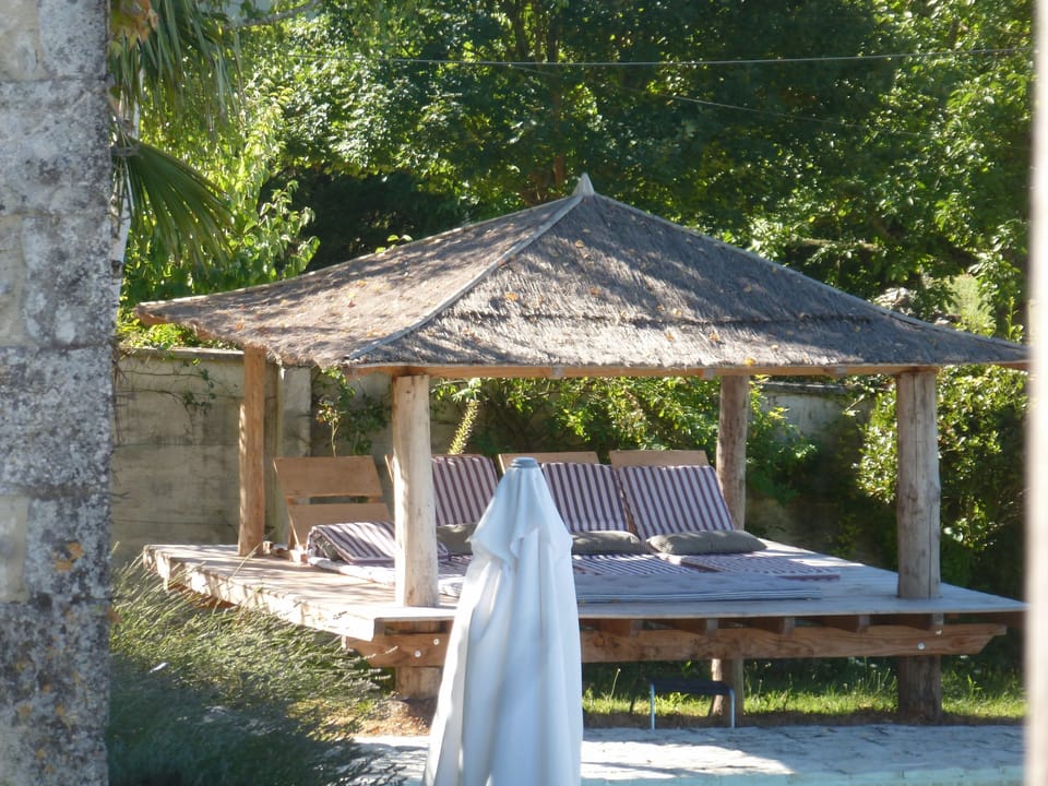 Lounge by the pool under the Bali house