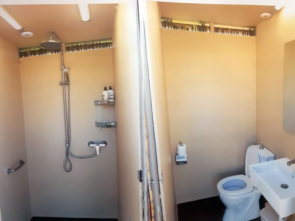 Exterior, W.C. and shower/changing room by the pool.