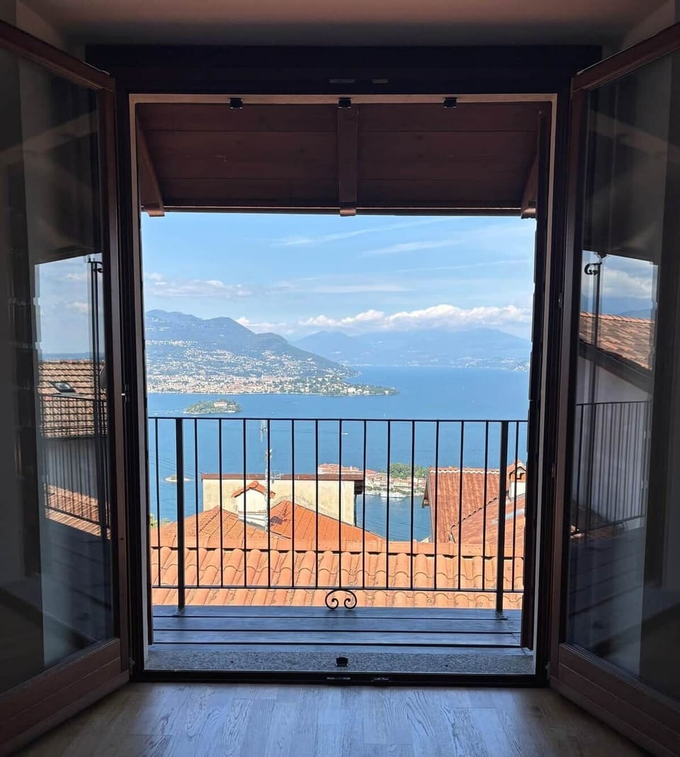 Open the doors and let the lake draw you in. Rooftops, water, and distant mountains come together in a moment that feels expansive and grounding, inviting quiet mornings, lingering pauses, and a deep sense of awe.