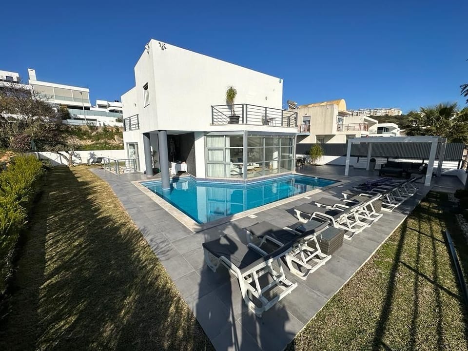Pool area and from of house 
