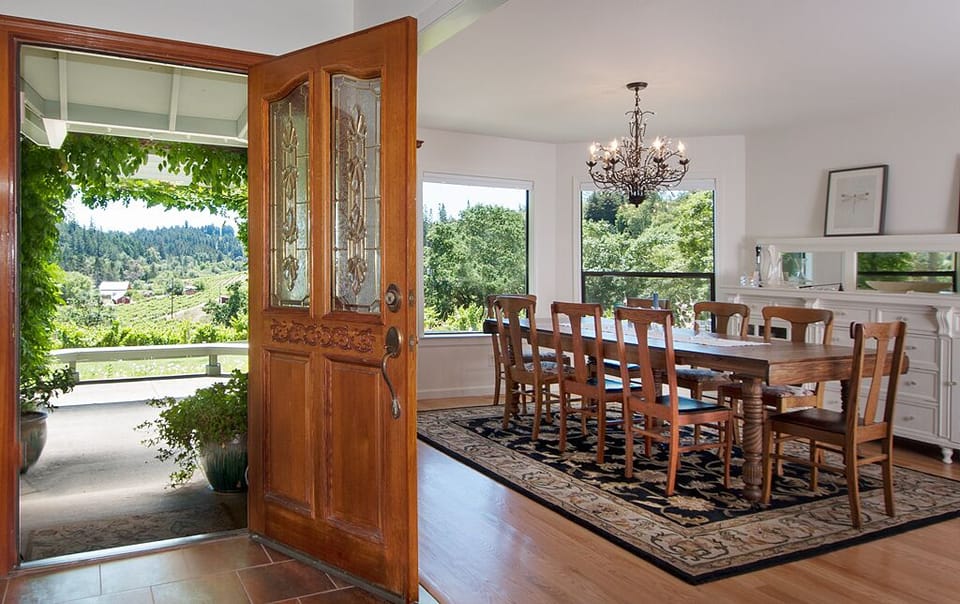  Front door entryway and dining room with sweeping vineyard views.