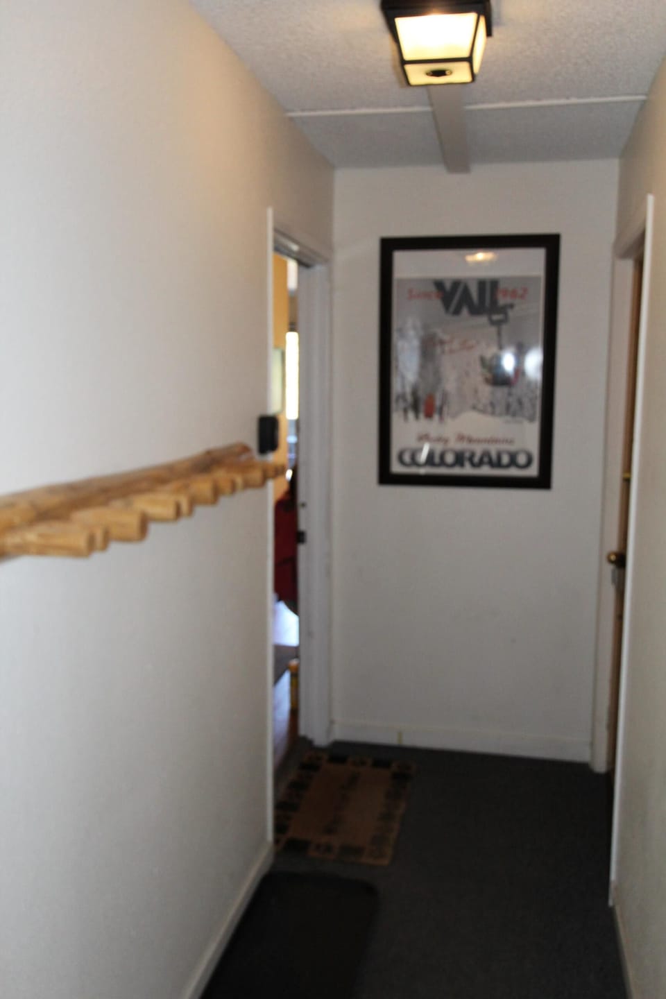 Hallway leading to condo. Ours is on left The ski rack is for you to use.
