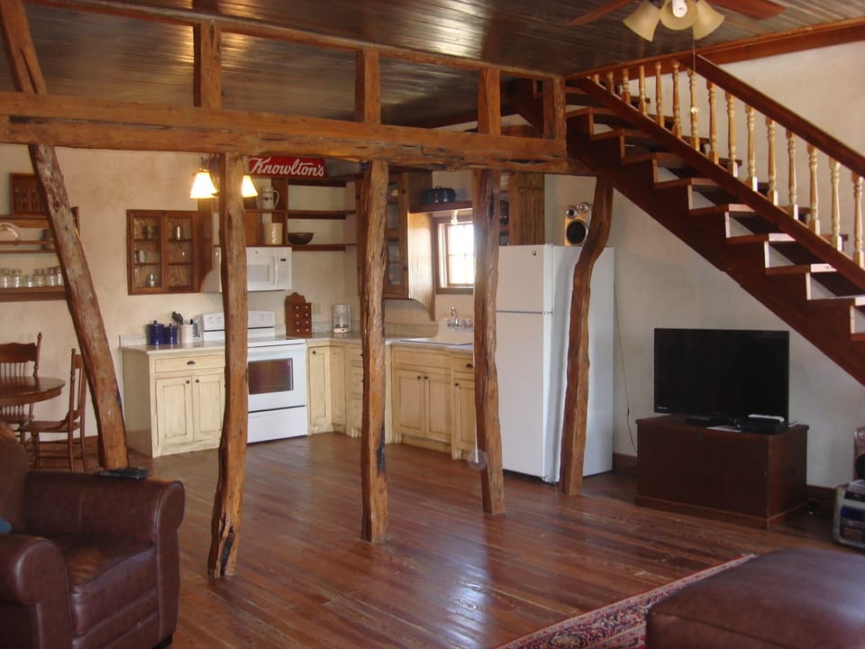 A mix of old and new!  Original hand hewn beams and satellite TV.