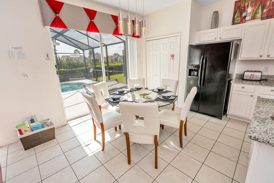 Beautiful sun filled kitchen area next to the pool deck door.
