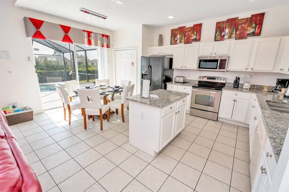 Stainless steel appliances and large sunny windows.