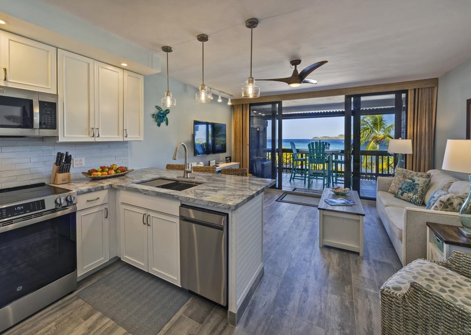 Bright, open kitchen and living area with waterfront views