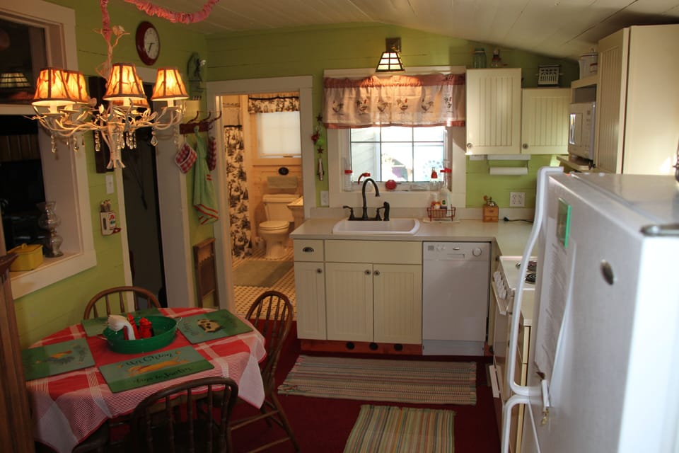 Kitchen with view into bathroom.