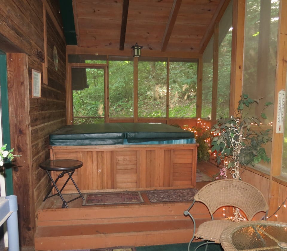 The hot tub when not in use with a private patio sitting area. 