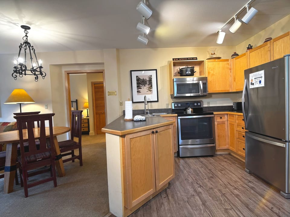 Fully equipped kitchen opens to the dining and living areas