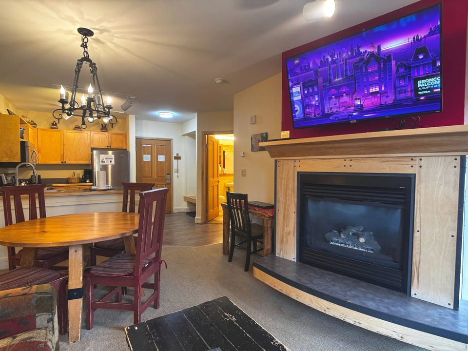 Cozy fireplace and TV for relaxing evenings at the condo