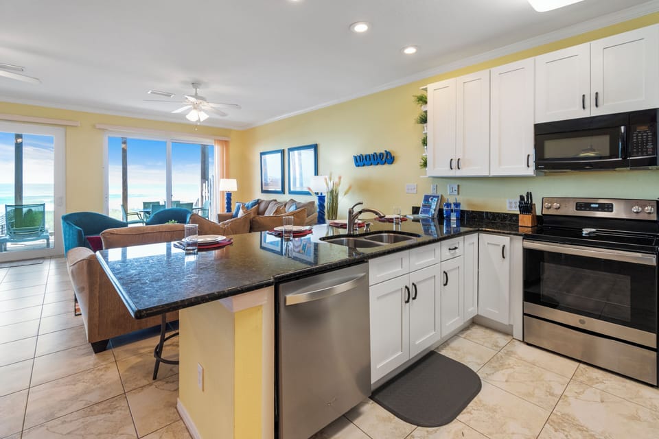 New cabinetry with SS appliances and granite countertops