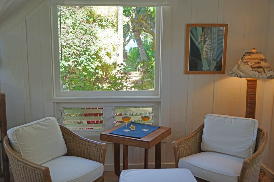 Moonrise Guest Cottage sitting area with a peek-a-boo view of the ocean.