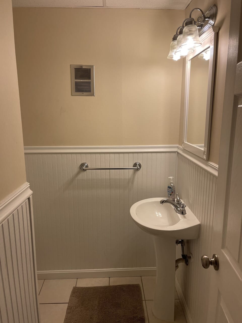 Half bath on 1st floor between kitchen and living room 