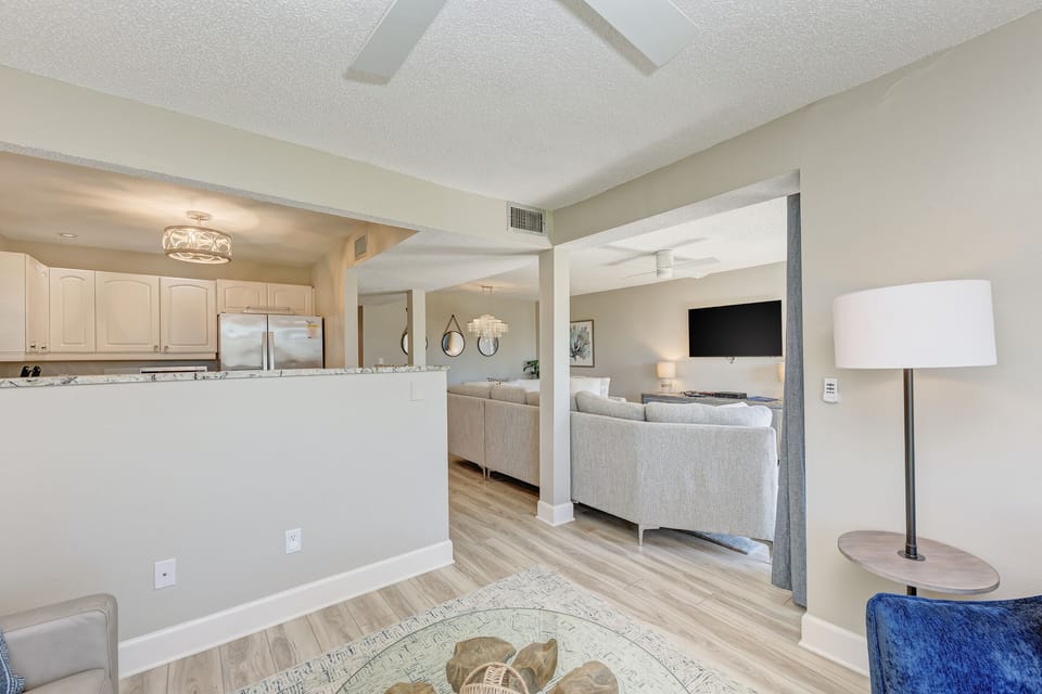 View of kitchen and living room from the sitting room.