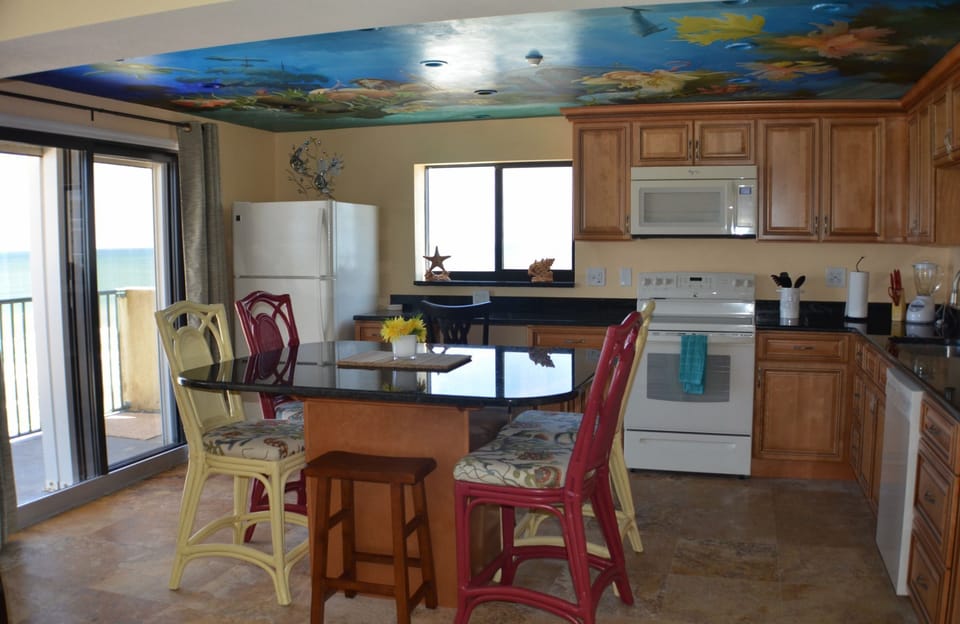 Kitchen with hand-painted ceiling mural