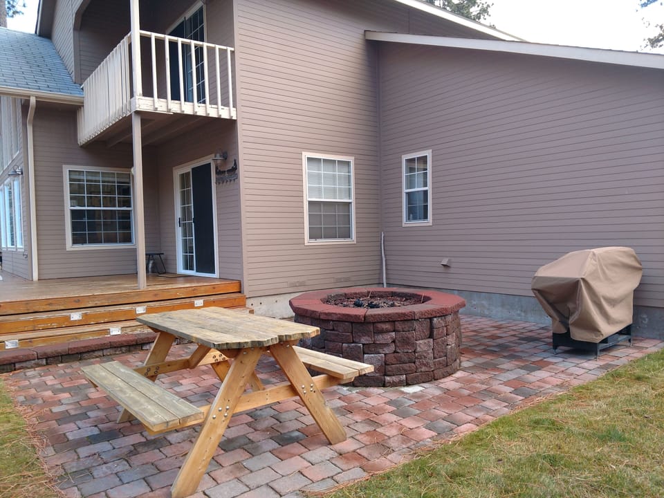 Picnic table, BBQ and fire pit.
