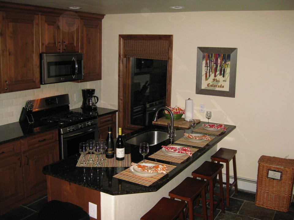 Kitchen counter can be used for overflow dining. Ideal for breakfast on the go.