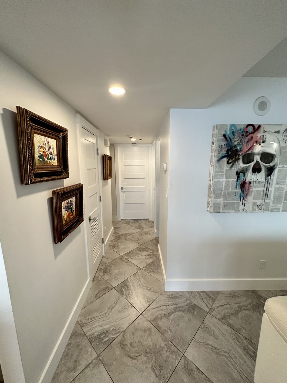 Hallway to 2nd and 3rd bedrooms, and 2nd full bathroom