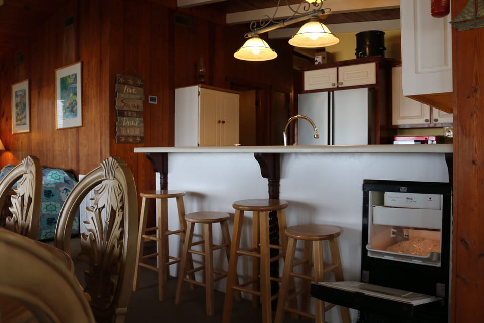 kitchen with bar seating and stand alone ice maker
