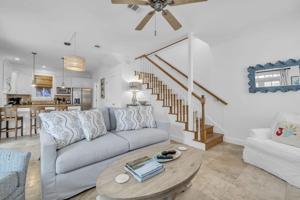 Living room featuring Queen size Sleeper Sofa/3 side chairs/Large Smart TV, Decorative only fireplace