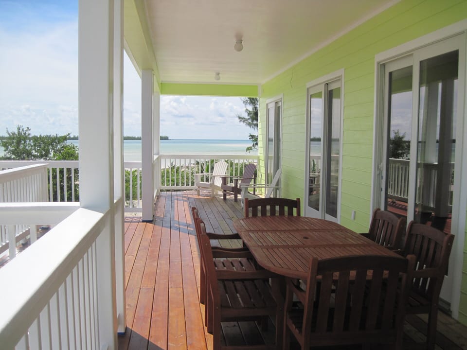 Outdoor dining and sitting area, sun deck to the left. Unobstructed views.