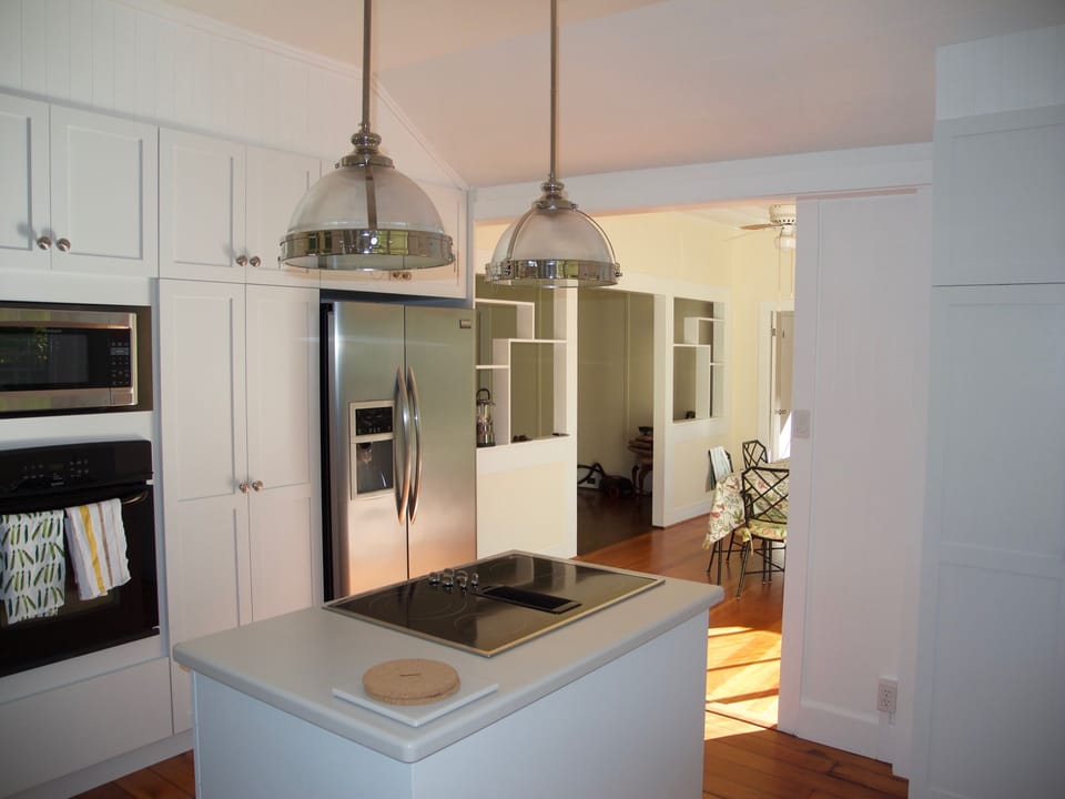 Kitchen island giving way to the sun room