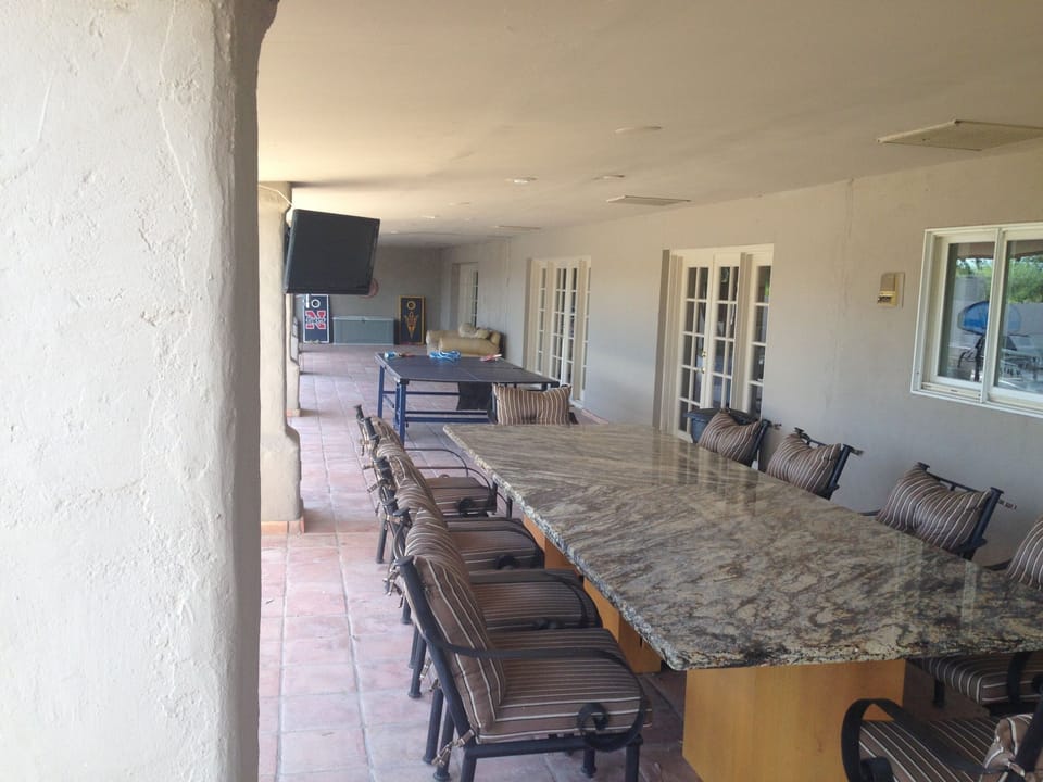 Outdoor dining, ping pong , TV sets and pool table