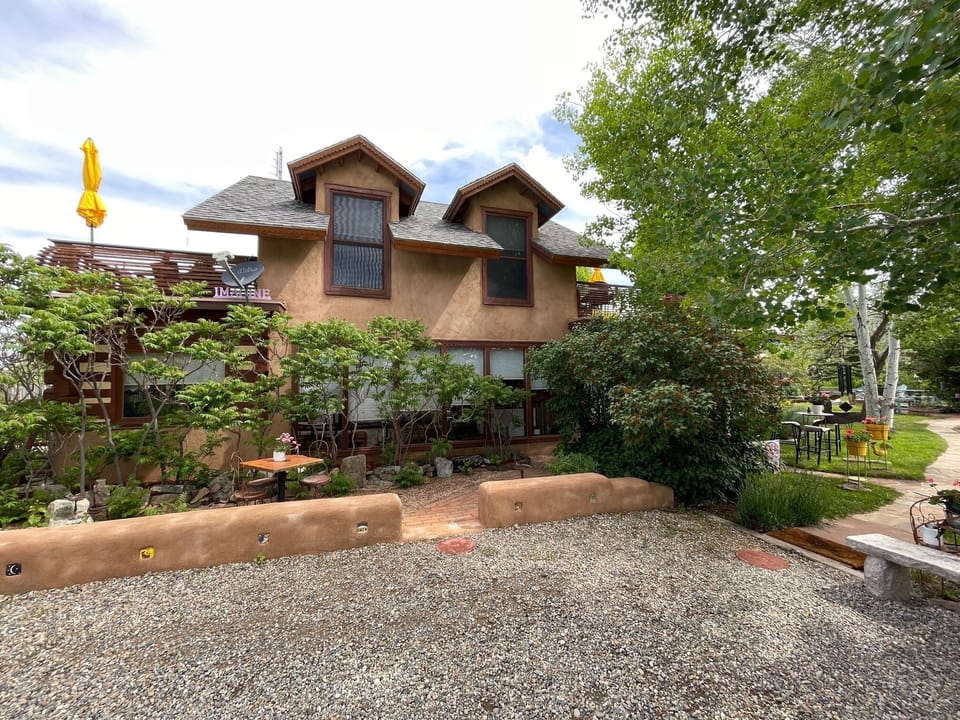 Southside view of The Casa Carmen, parking area, with flagstone walk!
