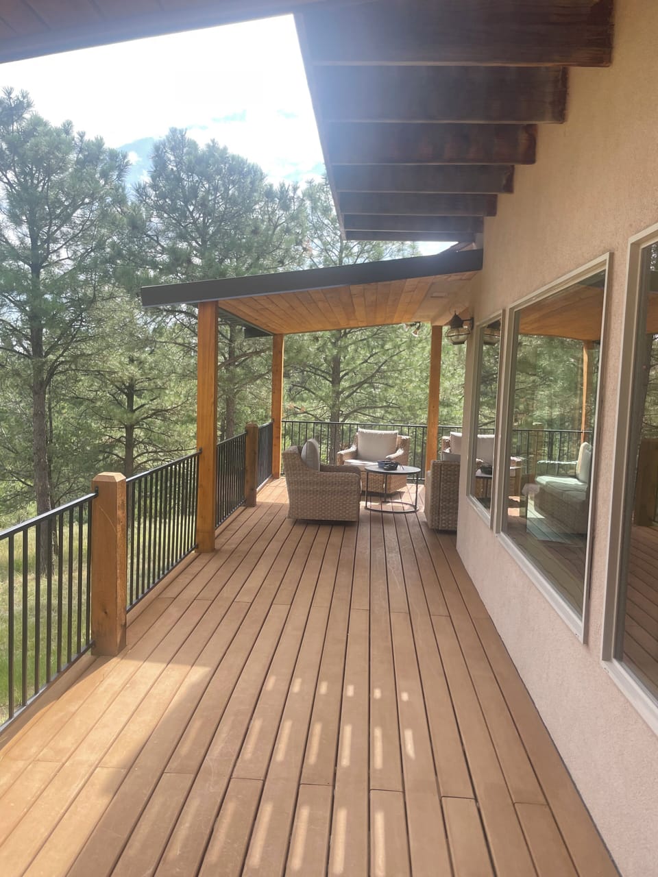 Outside covered seating area 4 swivel chairs plus a couch
