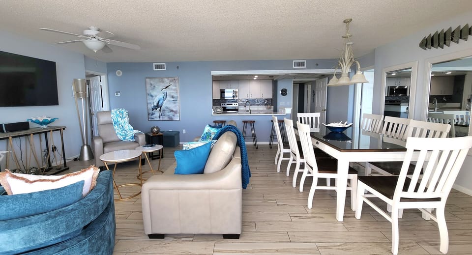 Plenty of seating in living area and enough for 8 at dining table..65" smart tv