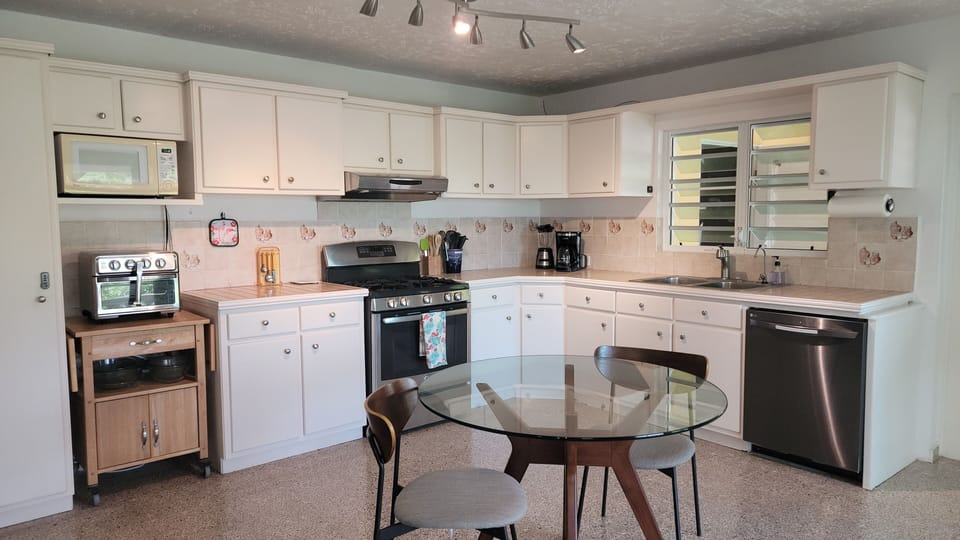 Full size kitchen with refrigerator,dishwasher, oven, microwave and dining area.