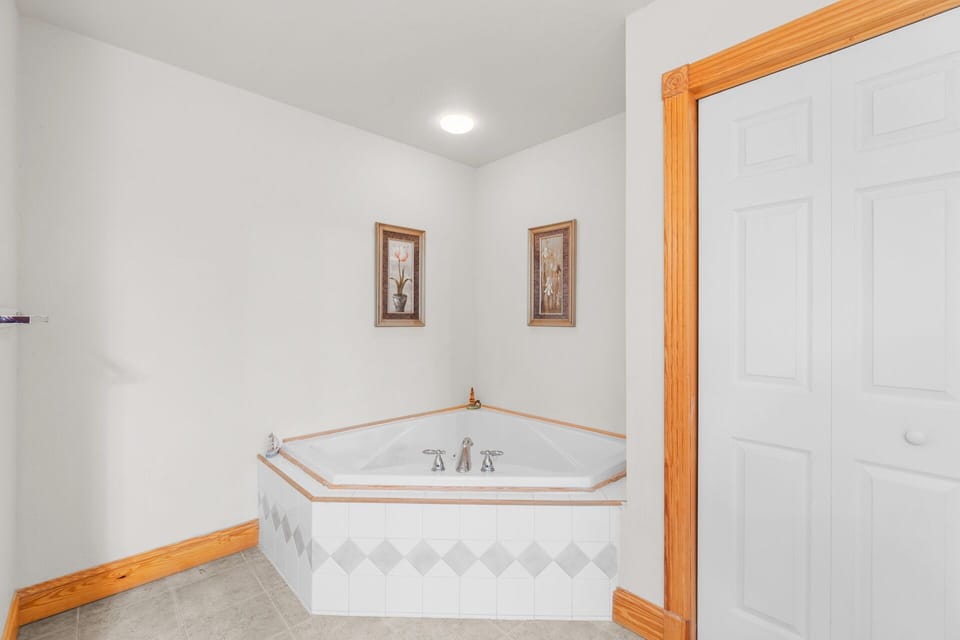 Soak your troubles away in a Jacuzzi tub in the private king master bathroom.